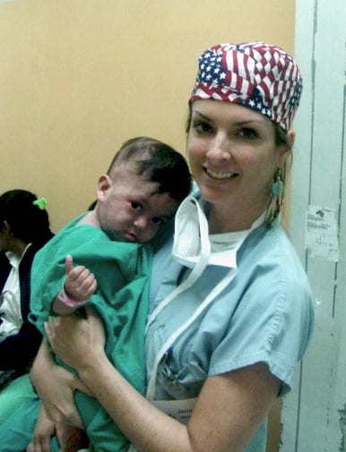 Dr. Walden with her young patient with a cleft palate awaiting surgery on her recent mission trip to El Salvador, June 2006.
